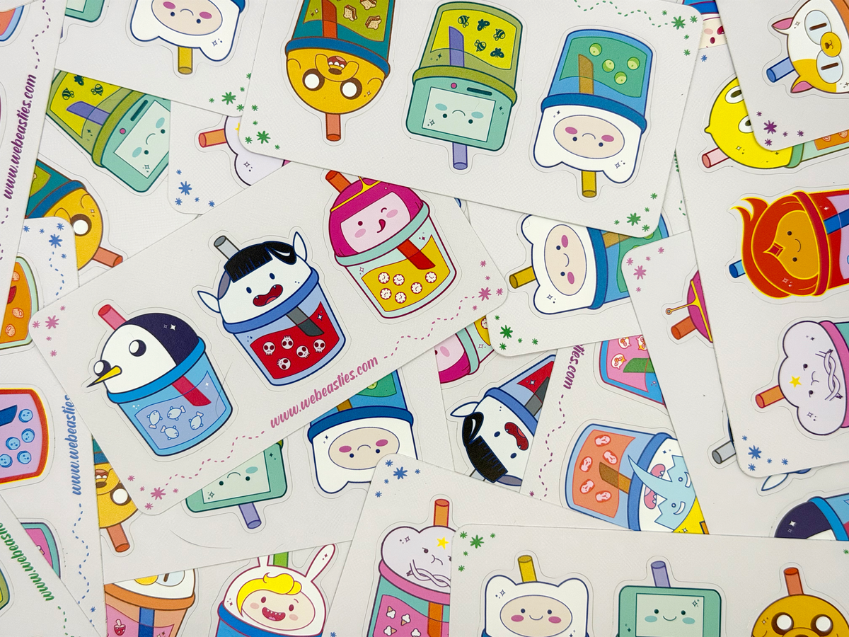 A pile of sticker sheets featuring Adventure Time characters as bubble tea drinks.